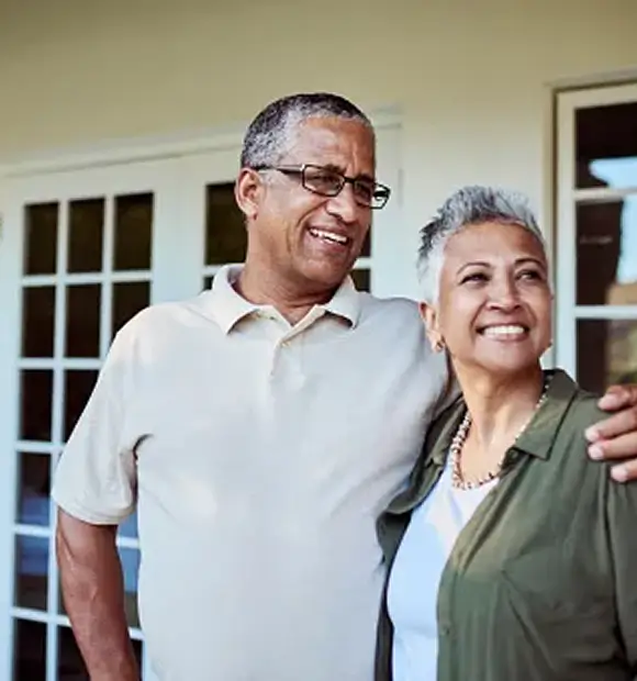 Smiling elderly couple representing satisfied homeowners